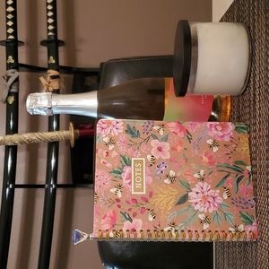 Note book with pink floral design.